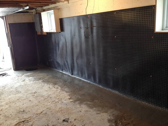 Dimple membrane installed on an interior basement wall