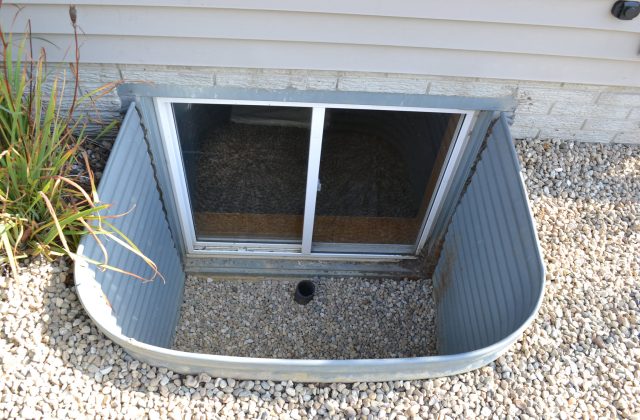 Basement window well drainage installation Basement window well drainage installation