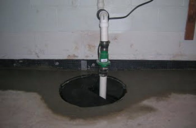 Sump pit and sump pump installed in a basement Sump pit and sump pump installed in a basement